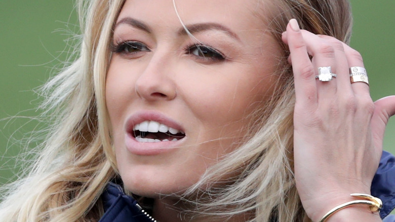 Paulina Gretzky tucks hair behind her ear