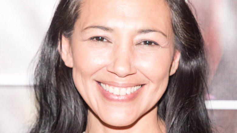 Irene Bedard posing at a movie premiere