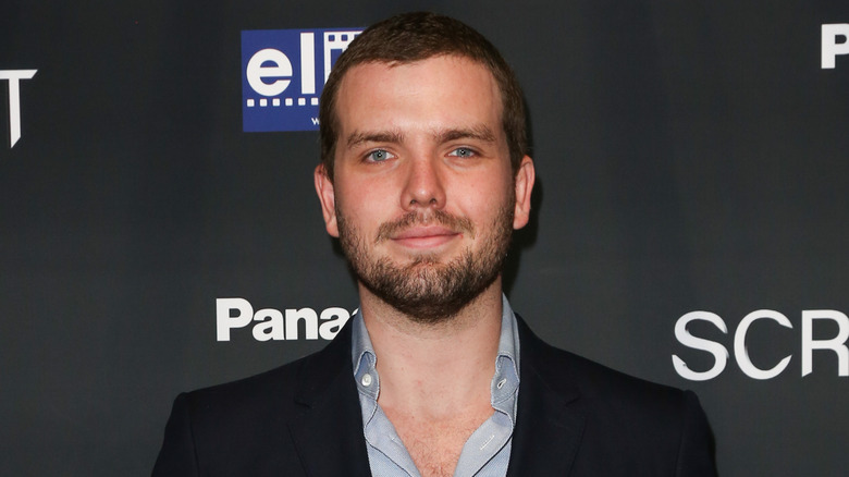 Austin Swift posing at an event