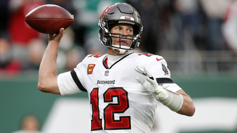 Tom Brady aiming to throw a football