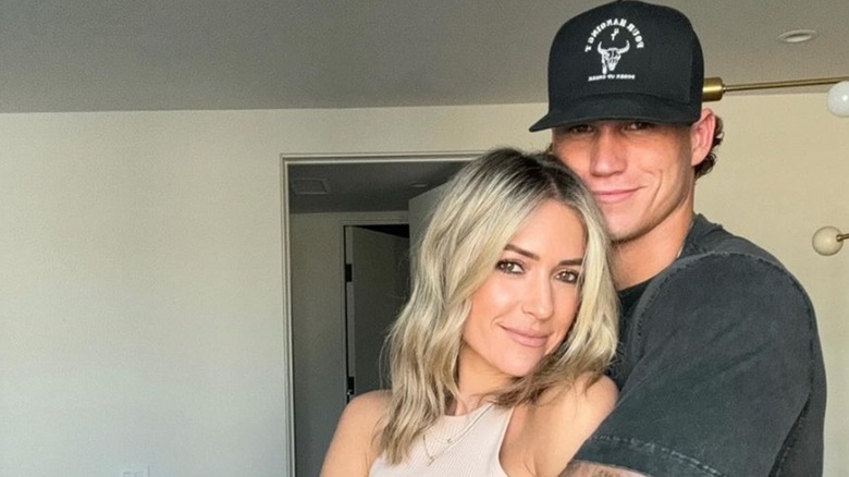Mark Estes embracing Kristin Cavallari 