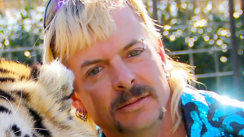 Joe Exotic with tiger and shades on head