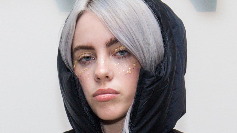 Billie Eilish staring blankly 