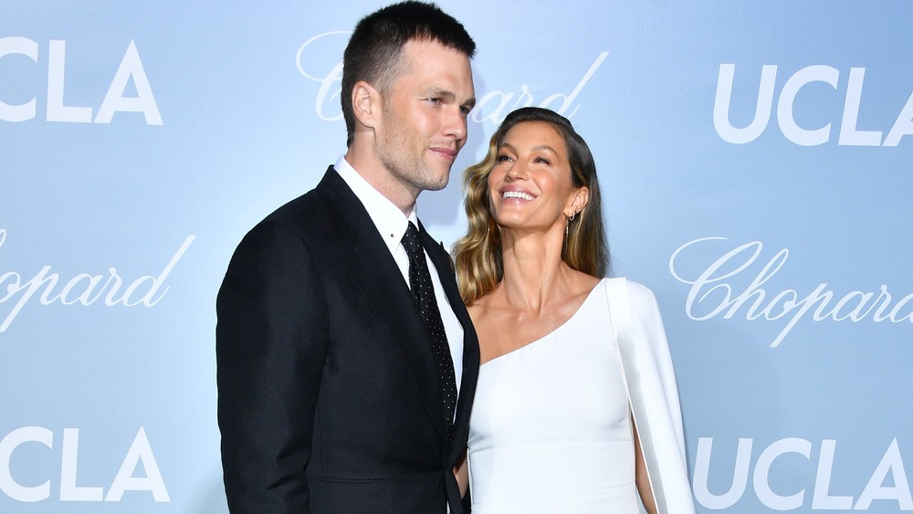 Tom Brady and Gisele Bundchen showing affection