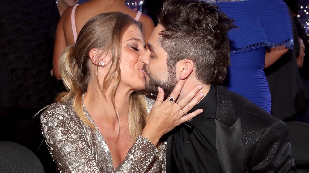 Thomas Rhett and Lauren Akins kissing