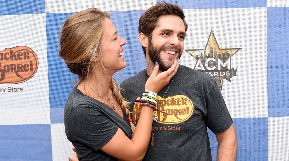  Lauren Akins holding Thomas Rhett's face