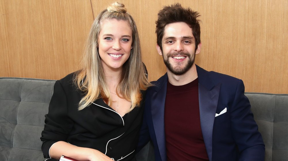 Lauren Akins and Thomas Rhett sitting down