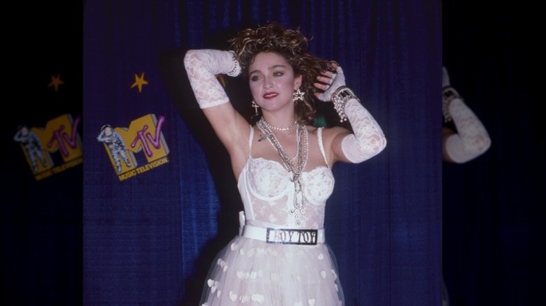 Madonna posing with her hands in hair