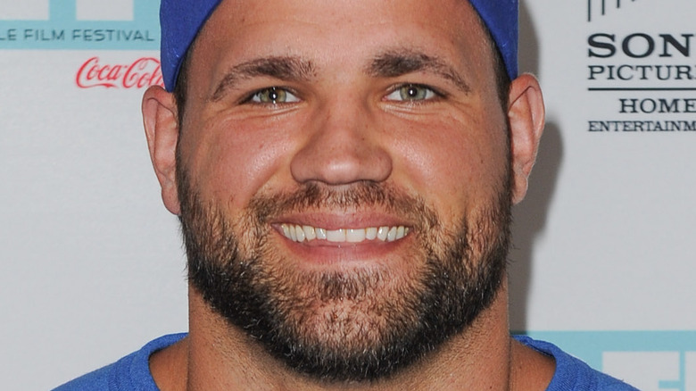 Peyton Hillis smiling blue baseball cap