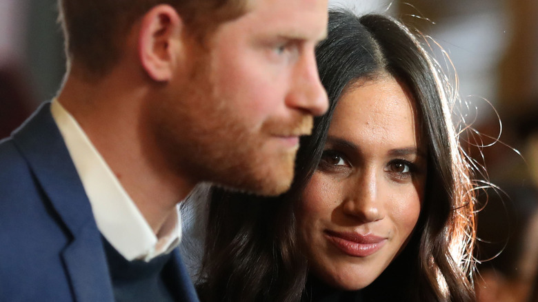 Prince Harry and Meghan Markle posing