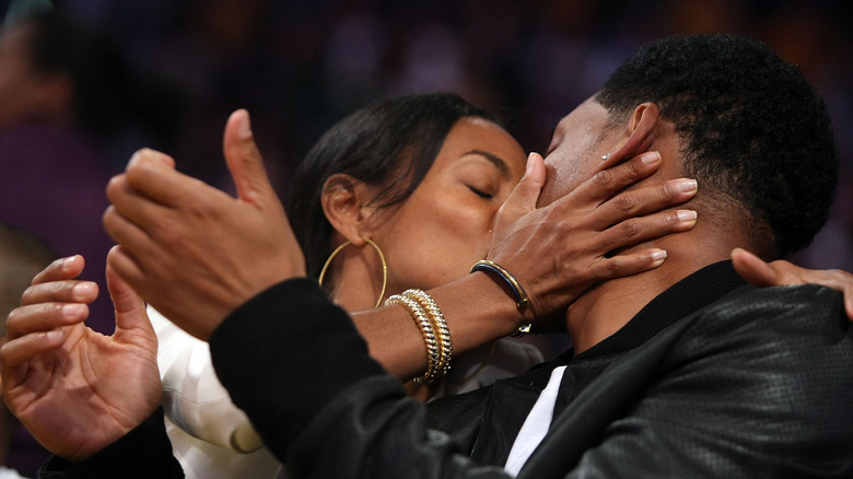Jada Pinkett and Will Smith kissing