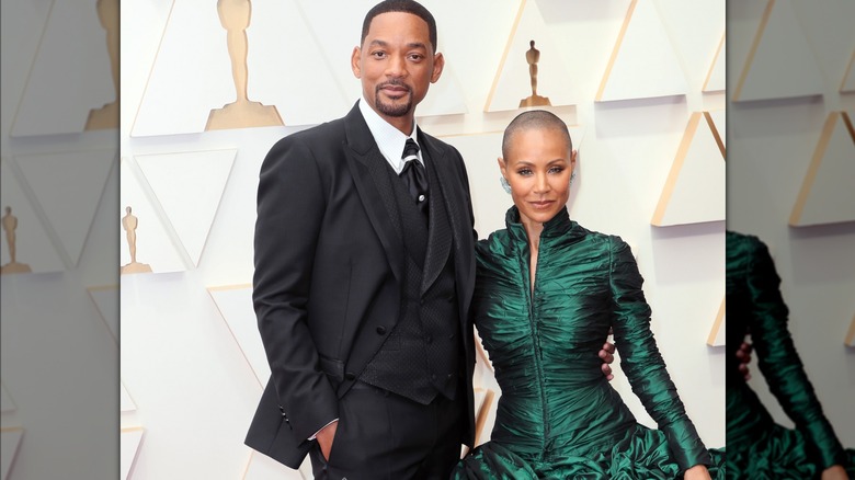 Will Smith and Jada Pinkett posing on red carpet