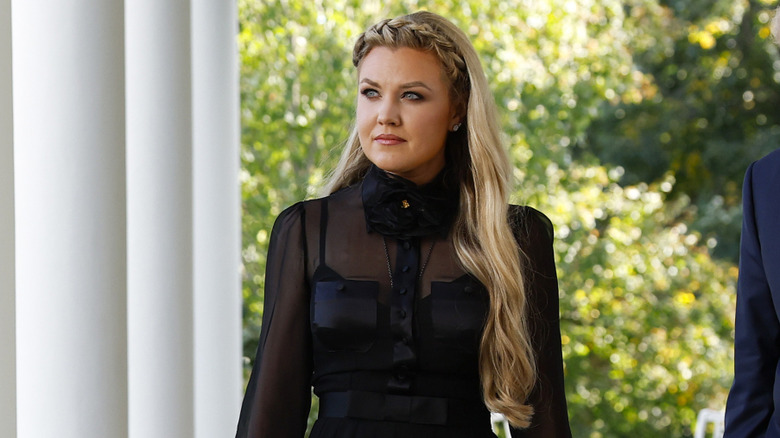 Erika Kirk pictured at the White House in a sheer black blouse