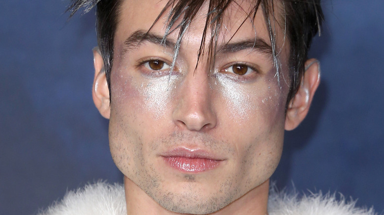 Ezra Miller wearing glittery makeup