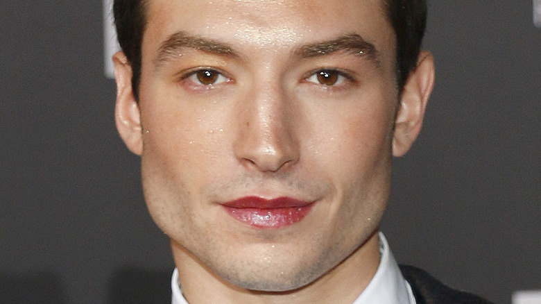 Ezra Miller with glitter on their face