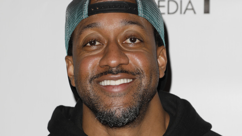 Jaleel White smiling in baseball cap