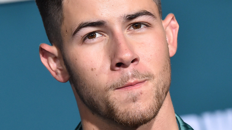 Nick Jonas posing red carpet