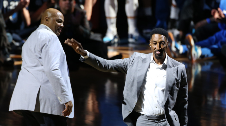 Charles Barkley and Scottie Pippen hand out