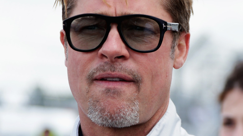 Brad Pitt frowning in aviators