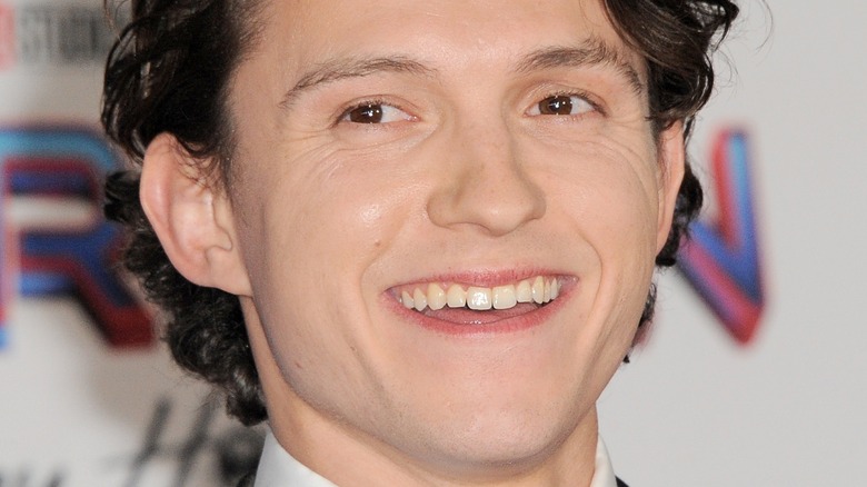 Tom Holland grins