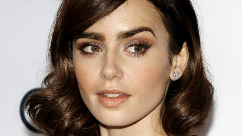 Lily Collins posing 