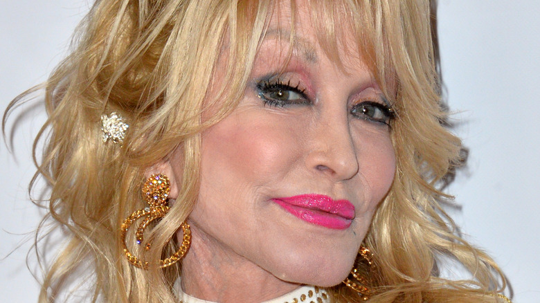 Dolly Parton smiles on red carpet at the 2019 MusiCares Person of the Year Gala