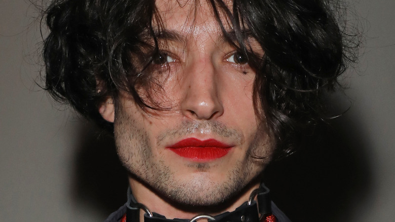 Ezra Miller red lipstick messy hair