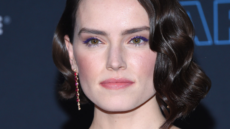 Daisy Ridley wearing purple eyeliner