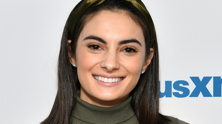 Paige DeSorbo green headband smiling