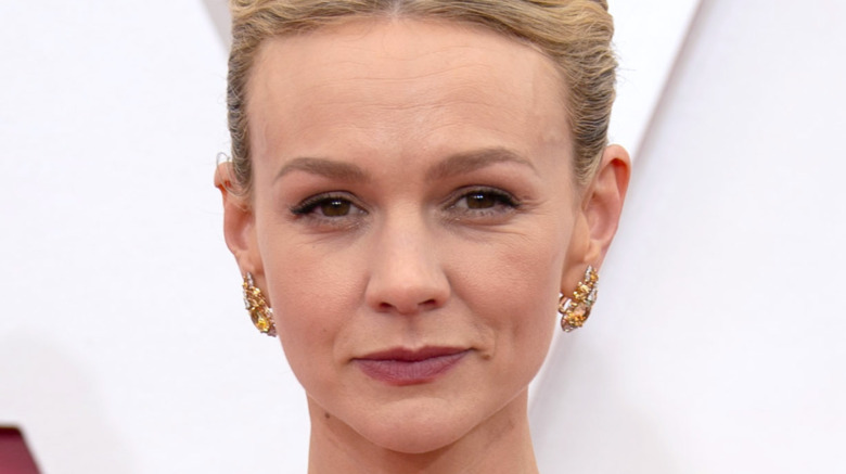 Carey Mulligan posing at the 93rd Academy Awards