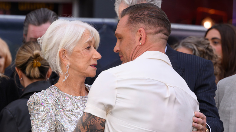 Tom Hardy and Helen Mirren embracing at MobLand premiere