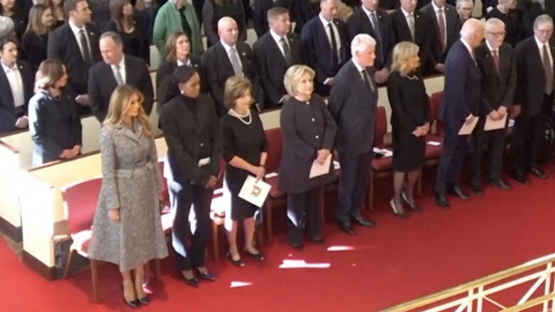 Melania Trump wearing gray at Rosalynn Carter's funeral next to other past first ladies and presidents