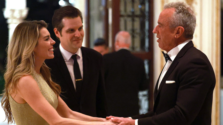 Robert F. Kennedy Jr. talking with former U.S. Rep. Matt Gaetz and his wife Ginger Luckey Gaetz at the America First Policy Institute Gala held at Mar-a-Lago
