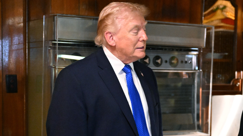 Donald Trump looks on during a tour of Graceland.