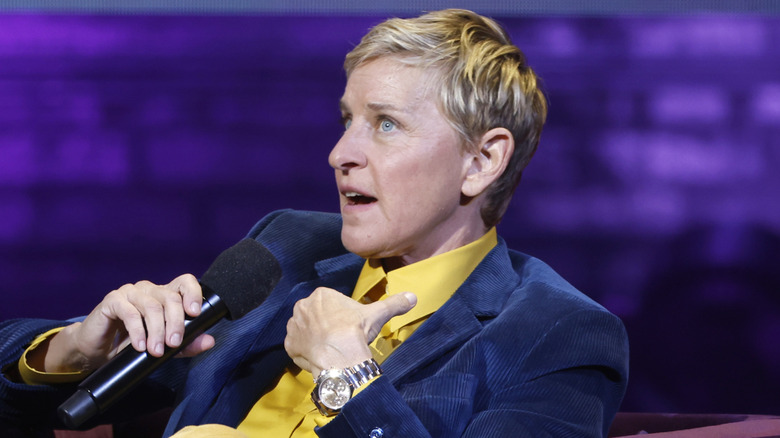 Ellen DeGeneres speaking on stage in 2022.