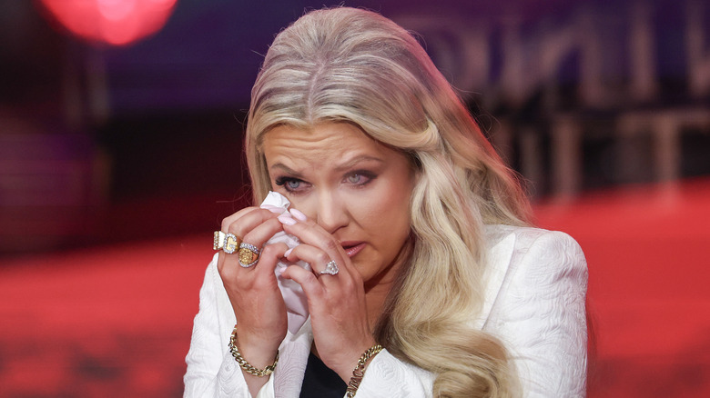 Erika Kirk dabbing her tears on stage at her husband's memorial.