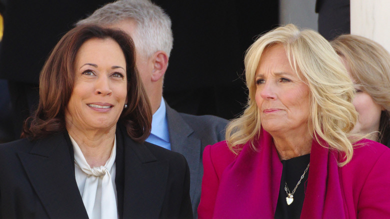 U.S. Vice President Kamala Harris sitting with First Lady Jill Biden at a Veterans Day ceremony at Arlington National Cemetery
