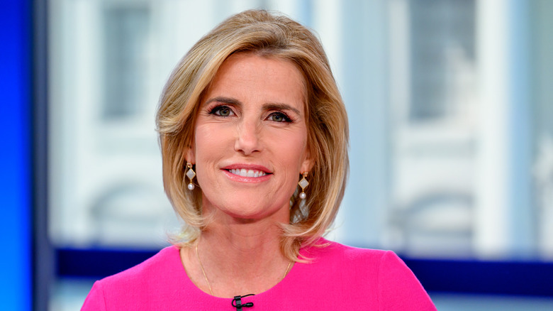 Laura Ingraham smiling at her desk