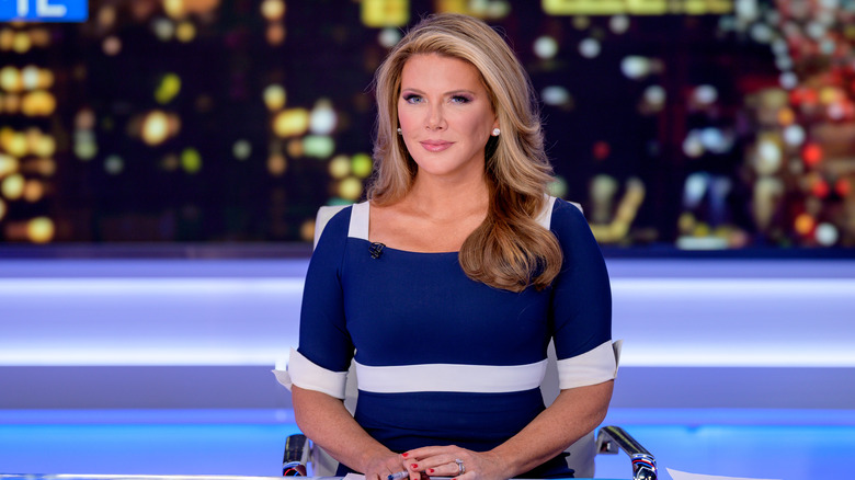 Trish Regan sitting at desk