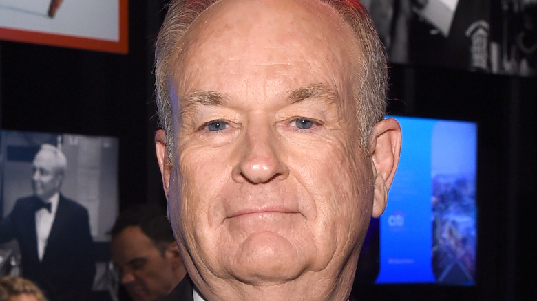 Bill O'Reilly smiling at camera with pursed lips