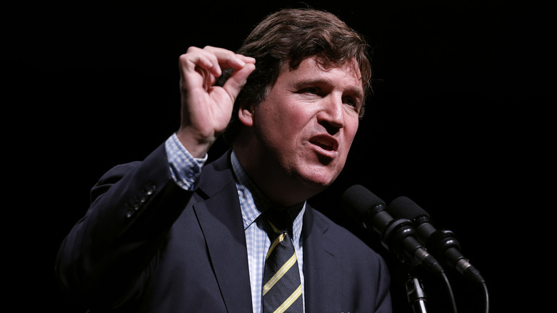 Tucker Carlson giving a speech