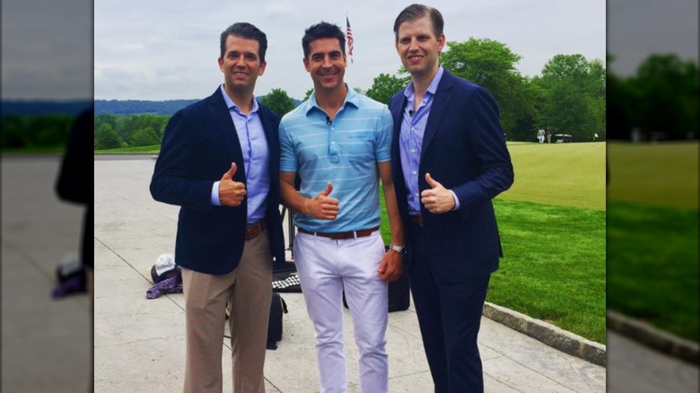 Jesse Watters posing with Donald Trump Jr. and Eric Trump.