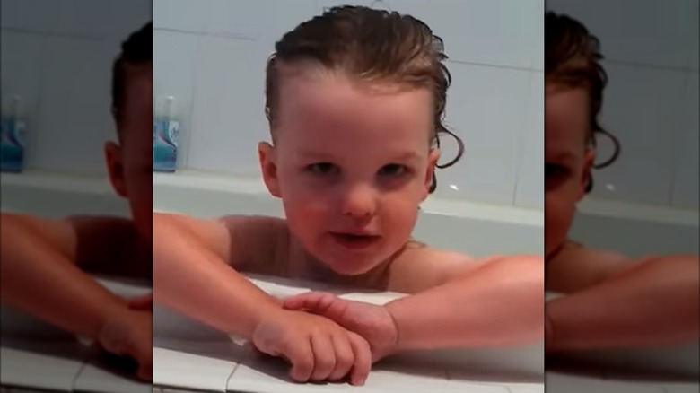 Young Iain Armitage in a bathtub
