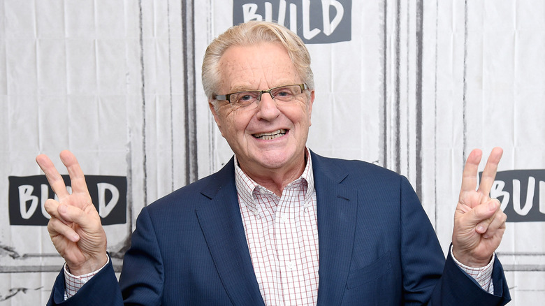 Jerry Springer peace signs