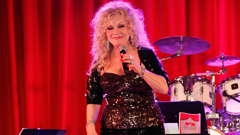 Stella Parton speaking at Stella Parton's Red Tent Women's Conference in 2014