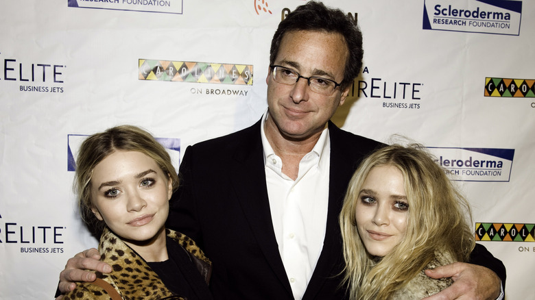 Bob Saget with arms around Olsen twins