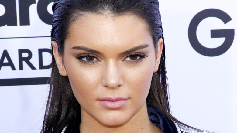 Kendall Jenner with her hair slicked back