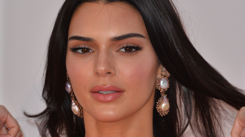 Kendall Jenner wearing dangly pearl earrings