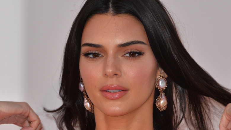 Kendall Jenner wearing dangly pearl earrings