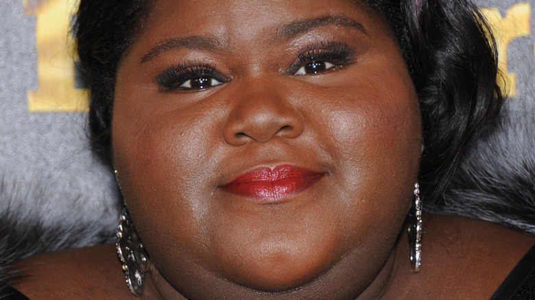 Gabourey Sidibe poses in red lipstick